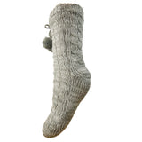 Knitted grey slipper sock with pom-pom on a white background